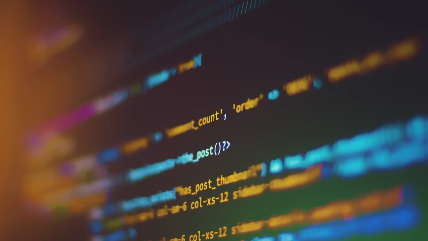 Developer working on code optimization on a laptop screen