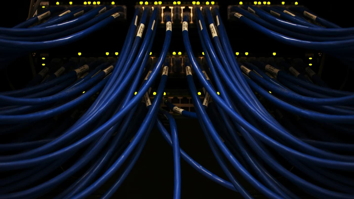 Network cables fanning out from a dark switch - representing data infrastructure behind GPT-5.5 Spud
