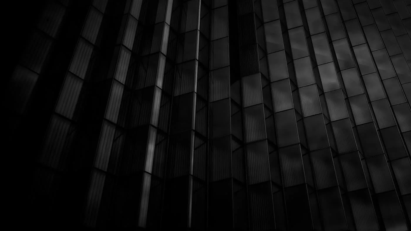 Dark grid of geometric cells representing tokens and API cost for Inkling