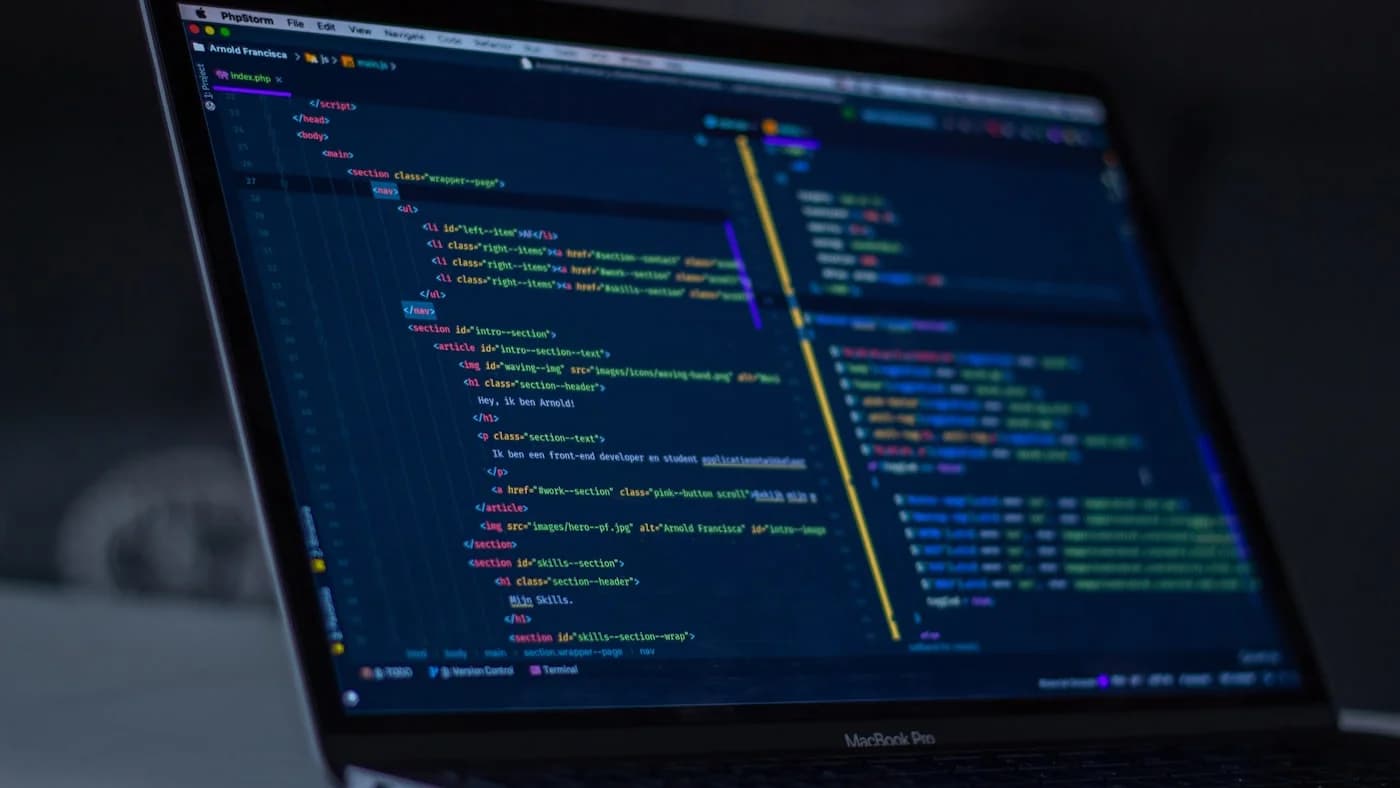 Code editor on dark screen showing AI coding assistant comparing Kimi K2.5 and GPT-5.4