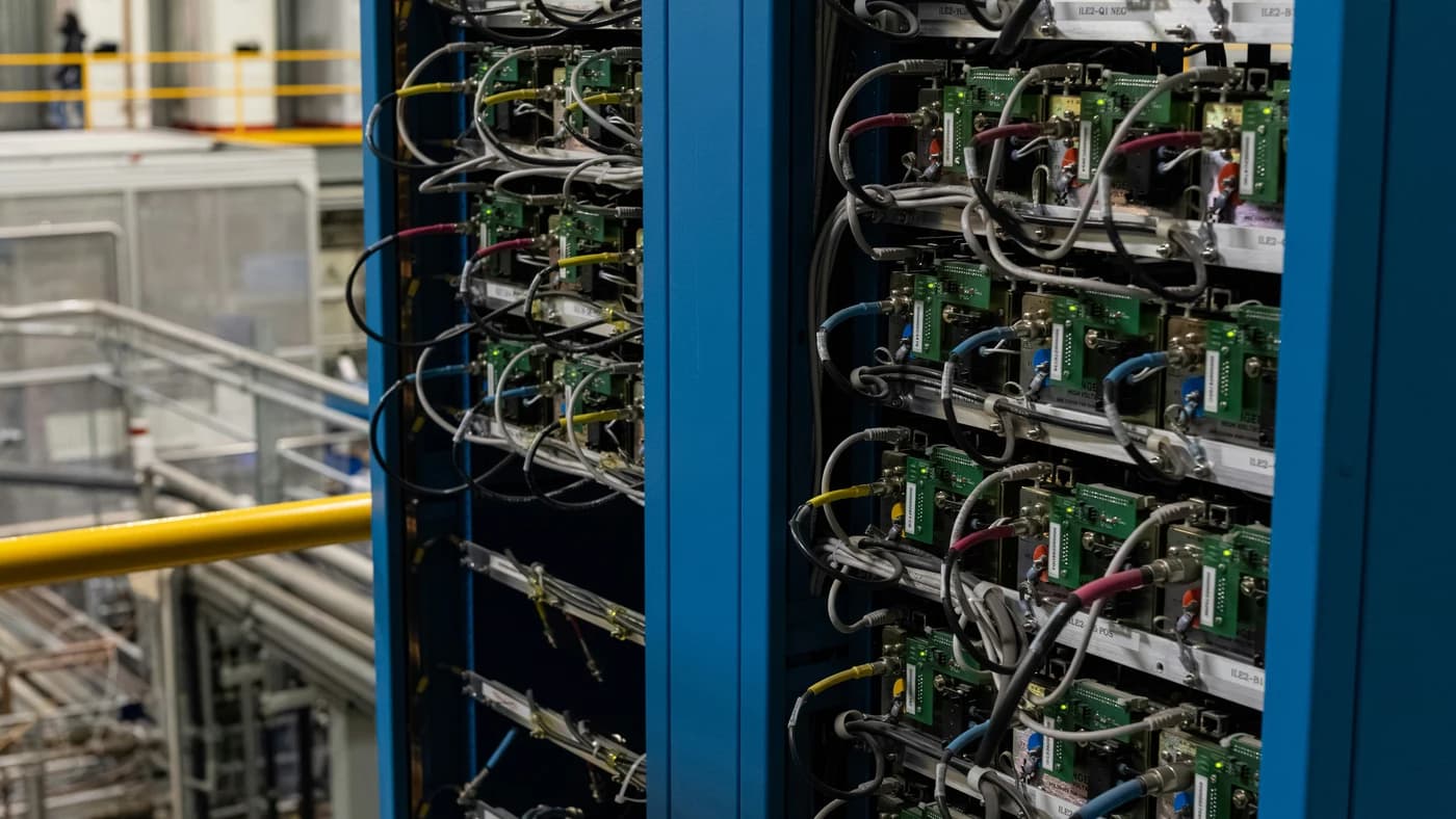 Dense server racks with complex cabling at a data center facility
