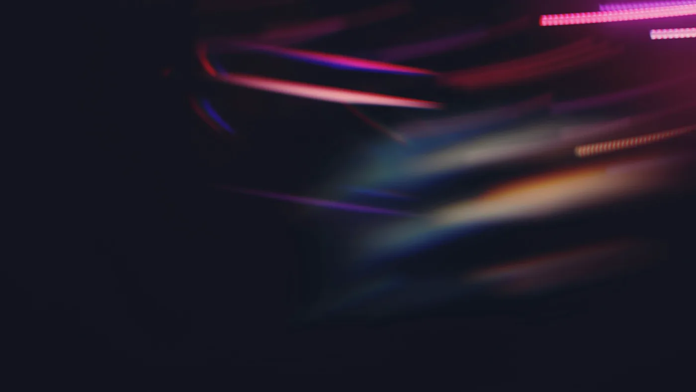 Abstract purple and red light streaks on a dark background representing multimodal token throughput