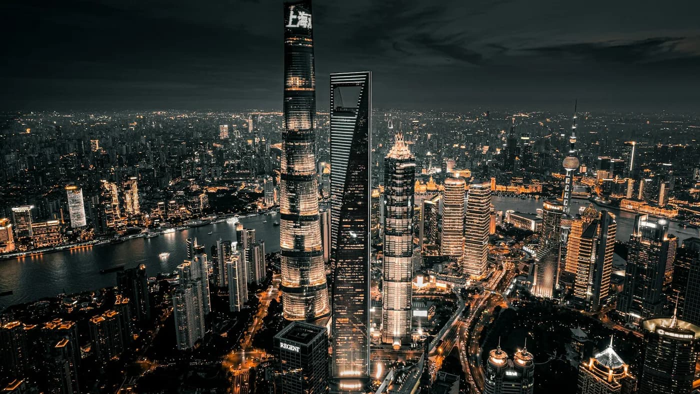Aerial night view of the Shanghai skyline, host city of WAIC 2026 where Qwen3.8 Max was previewed