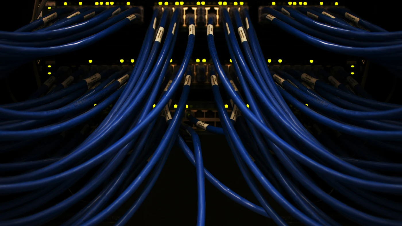 Network cables fanning out from a dark switch - representing data infrastructure behind GPT-5.5 Spud