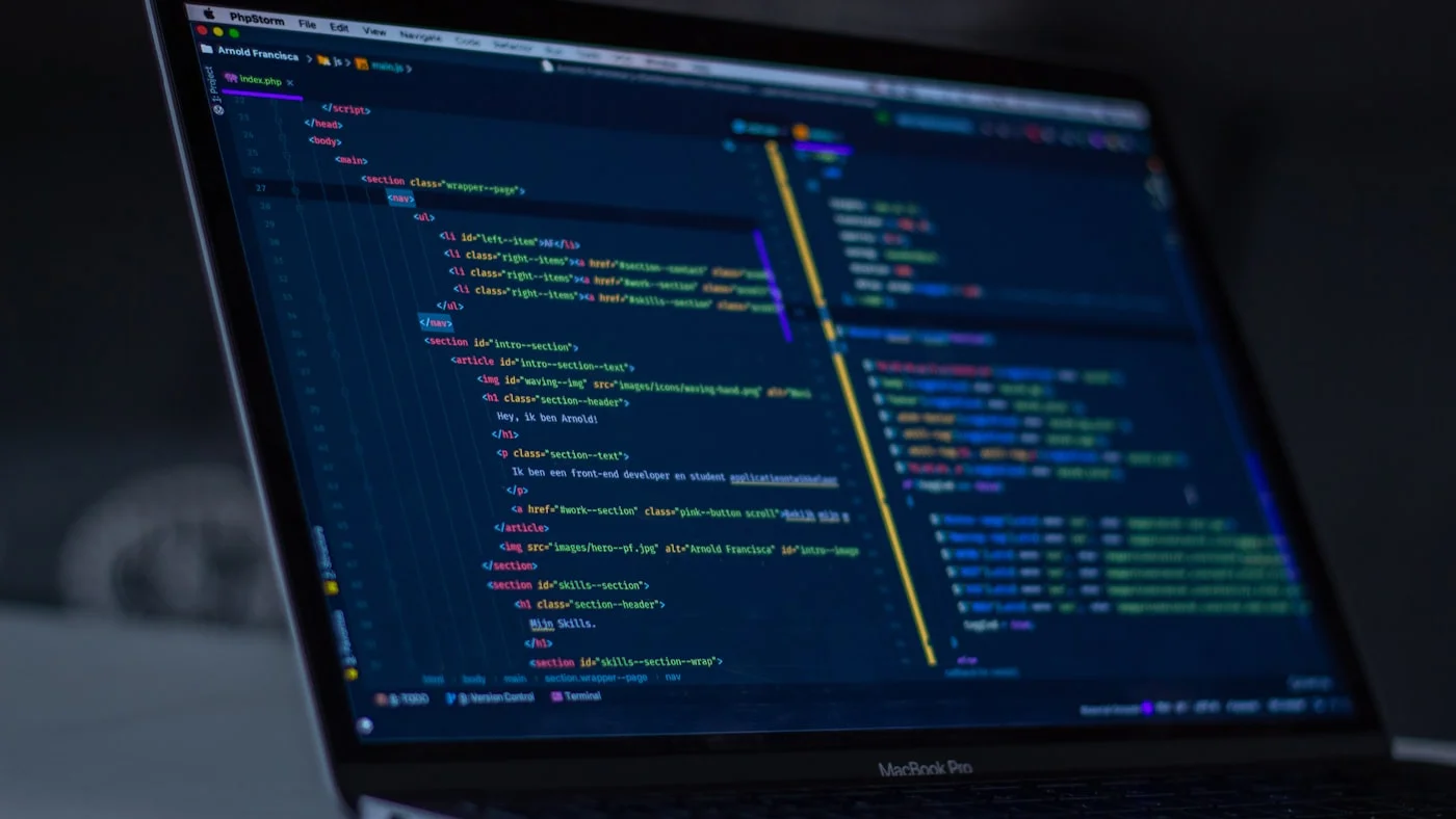 Code editor on dark screen showing AI coding assistant comparing Kimi K2.5 and GPT-5.4